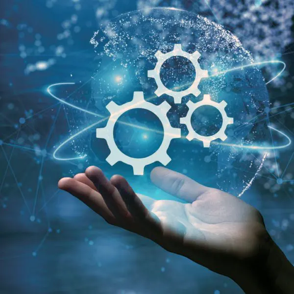 Automation - Hand with gear icons floating above